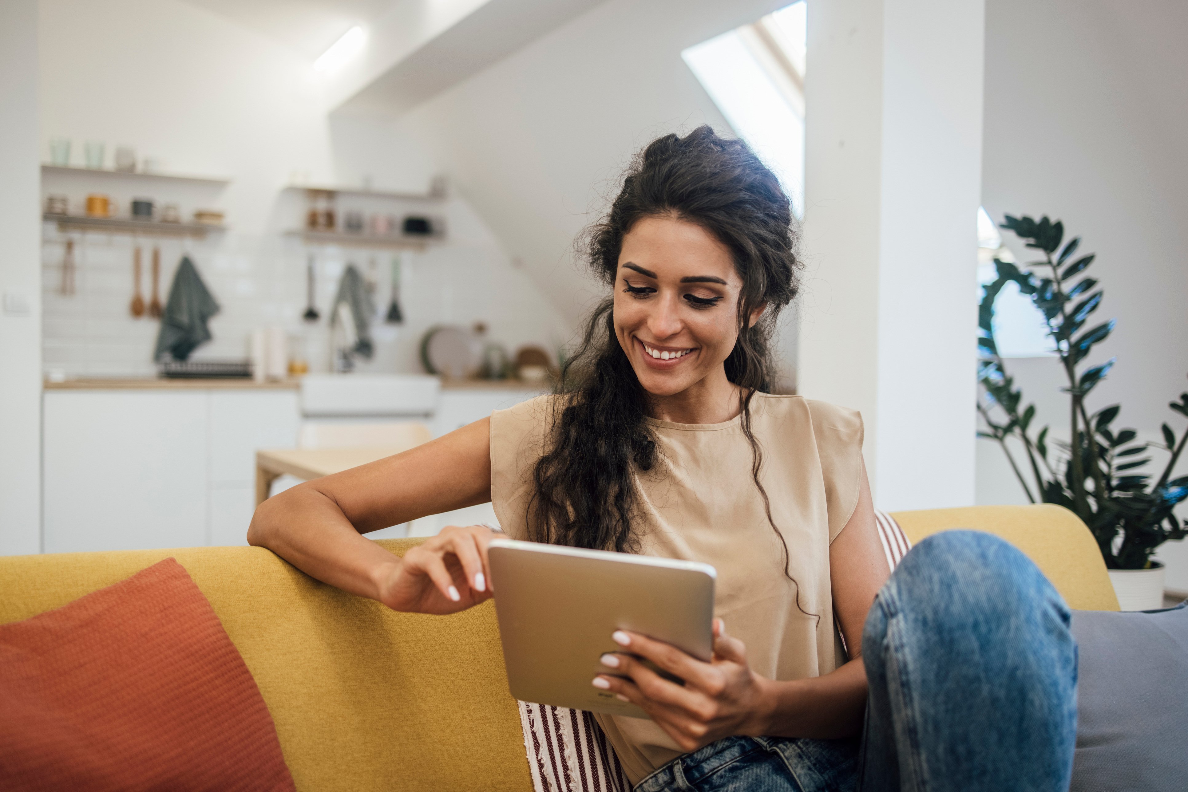 Woman smiling at tablet