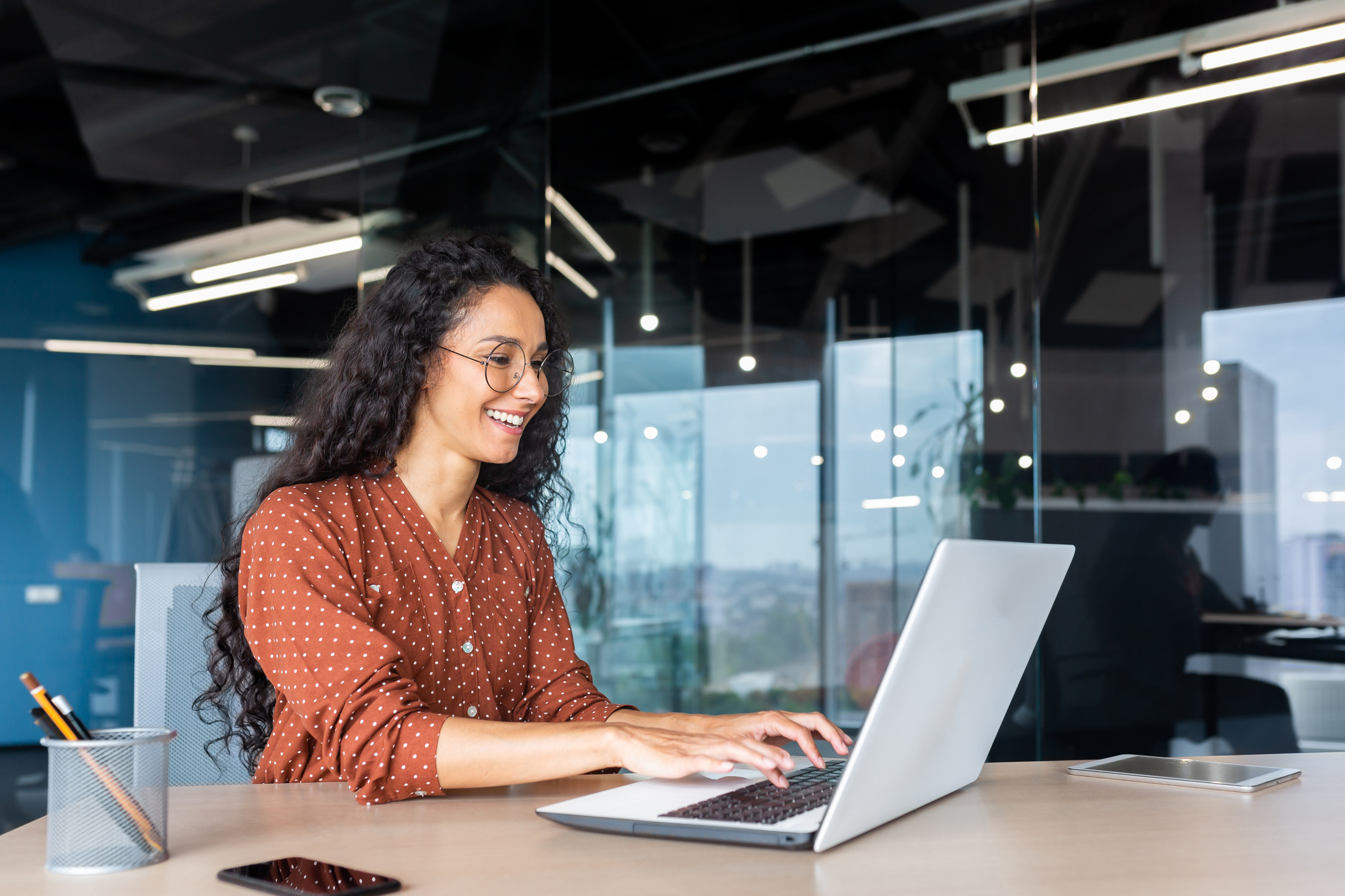 Person Smiling at Computer