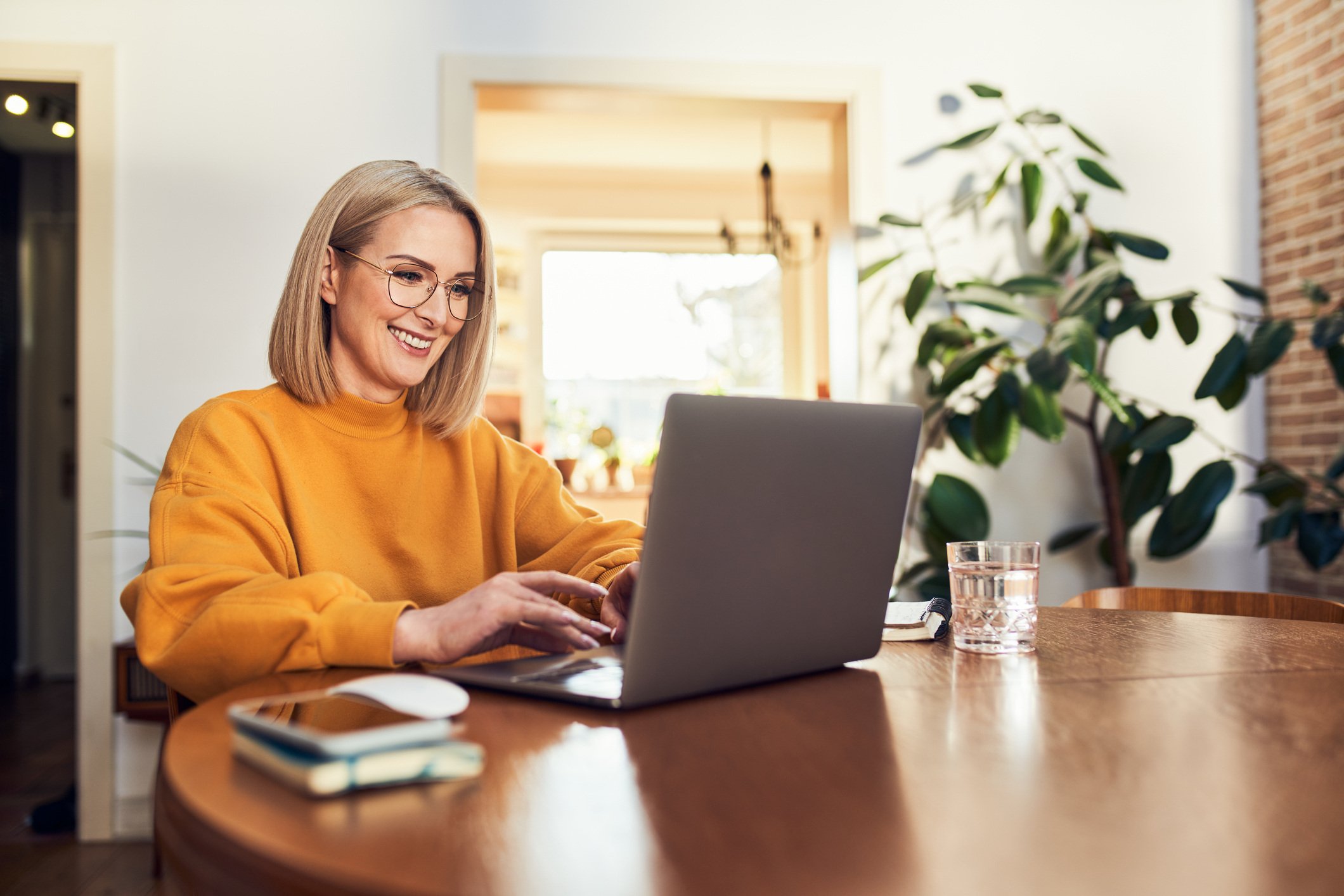 Woman smiling at computer