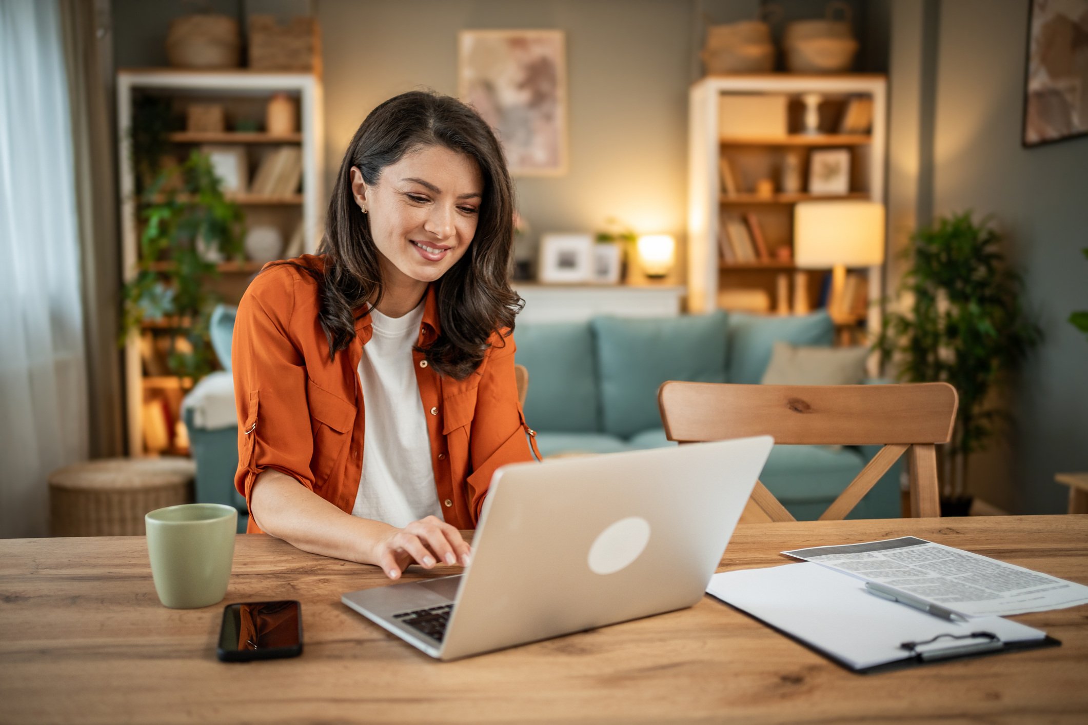 Woman smiling at computer