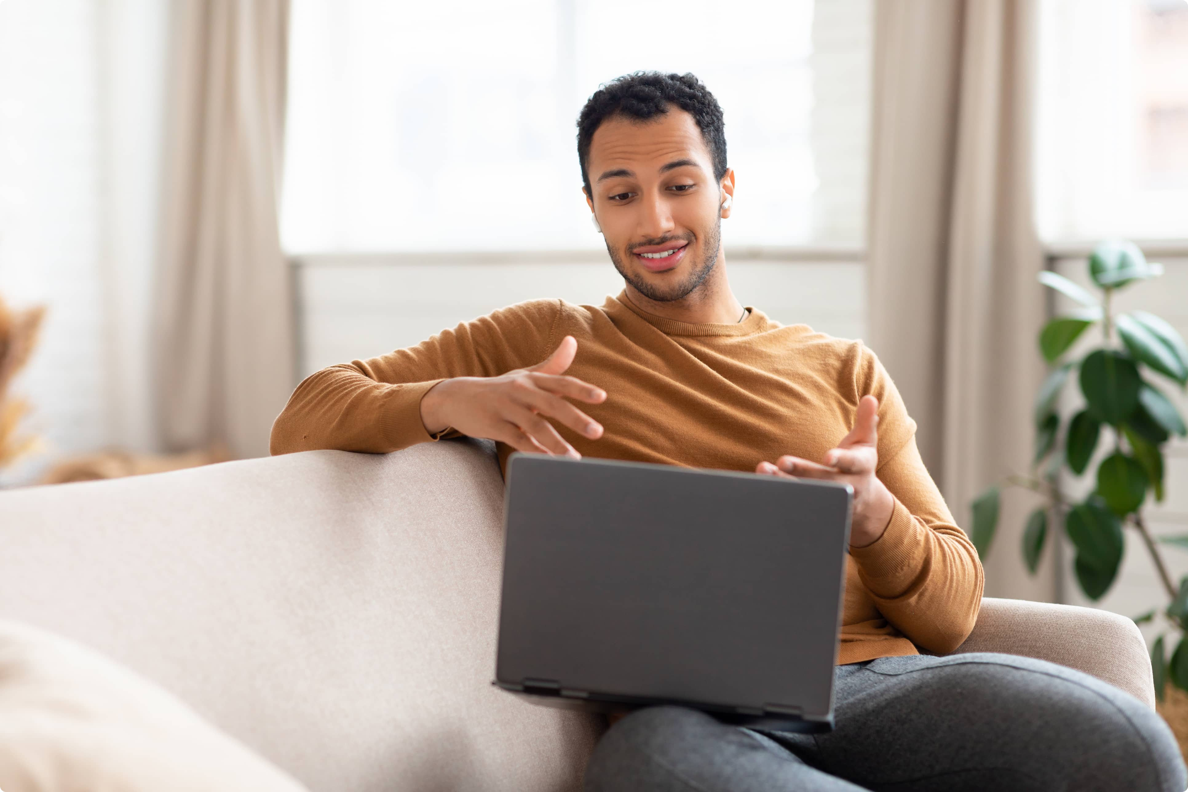 Man smiling at computer