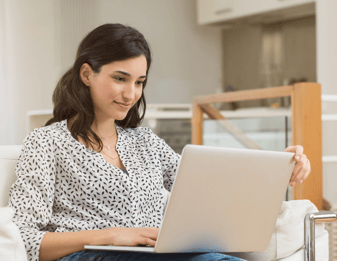 Woman smiling at computer