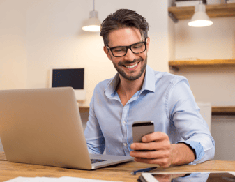 Man smiling at phone