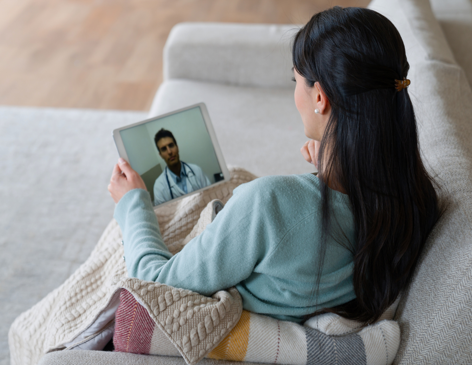 woman looking at her tablet 